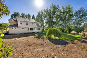 Back of house featuring garden space, could put a playset, large vegetable garden or sod