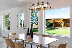 Dining room with a chandelier, exterior patio door to the back yard