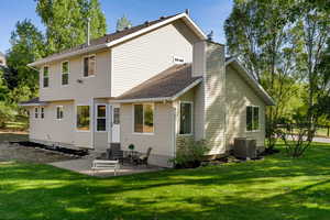 Rear view of house featuring a patio, and central AC unit