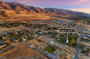 Aerial view at dusk featuring a mountain view looking south