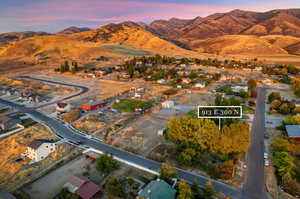 Aerial view of the corner lot and pasture with the potential to be rezoned, subdivided, sold or build another home in the 0.7 acre pasture