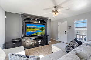 Tiled living room with ceiling fan