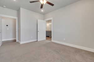 Spare room with ceiling fan and light colored carpet