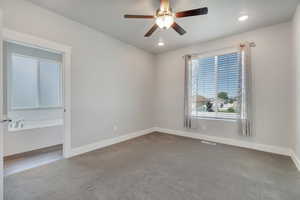 Room featuring carpet floors and ceiling fan