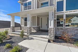 Doorway to property with covered porch