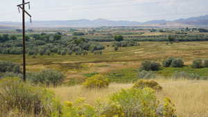 View of mountain background featuring rural landscape