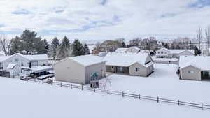 Snowy aerial view featuring a residential view