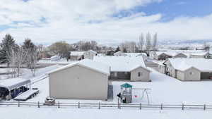 Snowy aerial view with a residential view