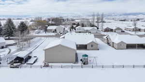 Snowy aerial view with a residential view