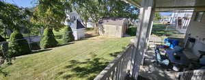 View of yard featuring a storage shed