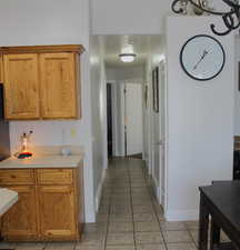 Kitchen featuring a textured ceiling and light tile patterned floors