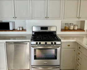 Kitchen featuring appliances with stainless steel finishes