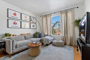 Sitting room featuring hardwood / wood-style floors