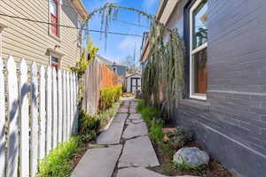 View of property exterior with a shed