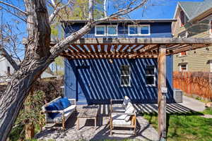 Exterior space with outdoor lounge area, a pergola, and central air condition unit