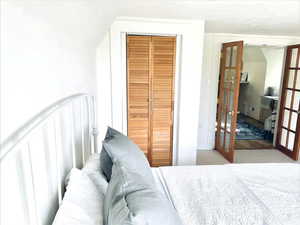 Bedroom featuring a closet and light hardwood / wood-style floors