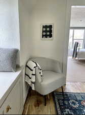 Sitting room with light hardwood / wood-style floors