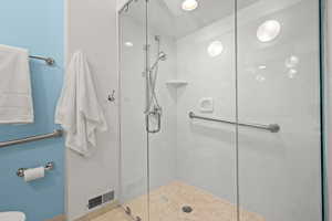 Bathroom with a shower with shower door