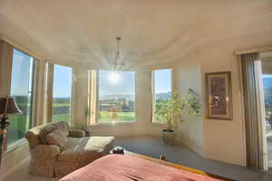 Bedroom featuring carpet floors and a mountain view