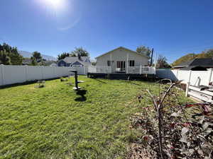 View of yard with a wooden deck