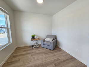 Sitting room featuring light hardwood / wood-style floors