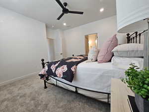 Bedroom featuring ceiling fan and carpet