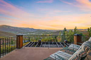 Balcony at dusk with a mountain view