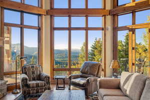 Sunroom / solarium with a mountain view and a wealth of natural light