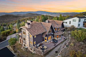 Aerial view at dusk featuring a mountain view