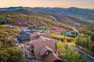 Aerial view at dusk featuring a mountain view