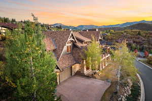 Aerial view at dusk featuring a mountain view