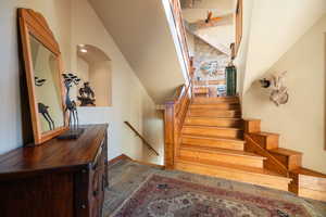 Stairway featuring a high ceiling