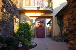 Property entrance featuring a balcony