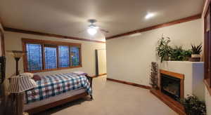 Bedroom featuring ceiling fan and light colored carpet