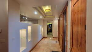 Corridor with a tray ceiling