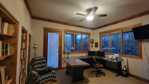 Carpeted office space with ceiling fan