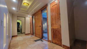 Foyer entrance with a raised ceiling