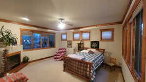 Bedroom featuring ceiling fan and light carpet