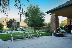 Exterior space with a playground and a mountain view