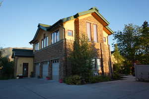 View of side of home featuring a garage