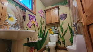 Bathroom featuring toilet and tile patterned floors