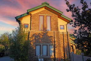 View of property exterior at dusk