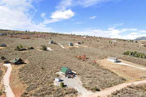 Birds eye view of property featuring a rural view