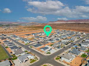 Birds eye view of property with a mountain view