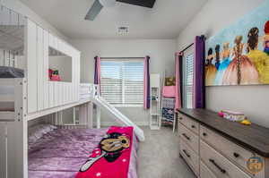 Bedroom featuring ceiling fan and light colored carpet