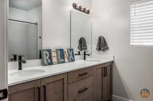 Bathroom with walk in shower and vanity