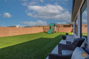 View of yard featuring a playground