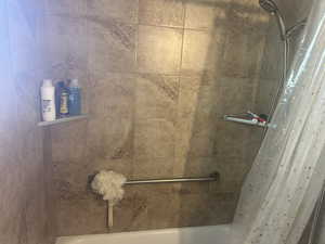 Bathroom #1 with shower / tub combo with curtain