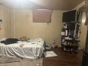 Bedroom #4 featuring dark hardwood / wood-style flooring