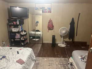 Bedroom #4 featuring dark hardwood / wood-style flooring